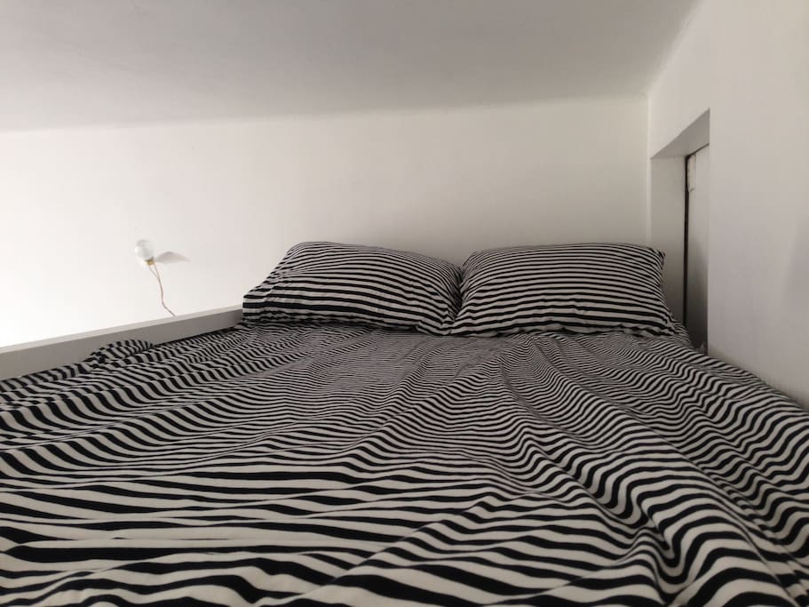 Double bed on a loft