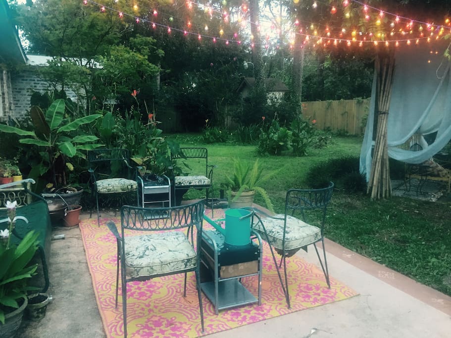 Luscious outdoor space with a variety of botanicals, patio and trellis space used for day and night time. This space is where all smoking is allowed. Use ashtray please.