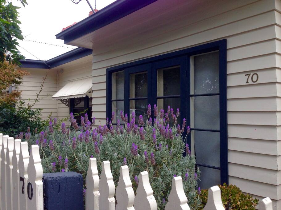 Private entrance and french doors which open from living room to front garden