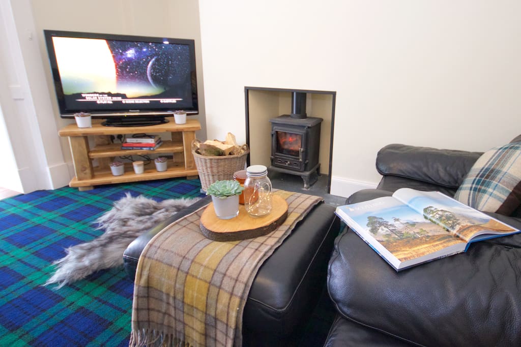 Living Room - Relax here with a crackling log fire, big screen TV, Blu Ray dvds, and even a Netflix account