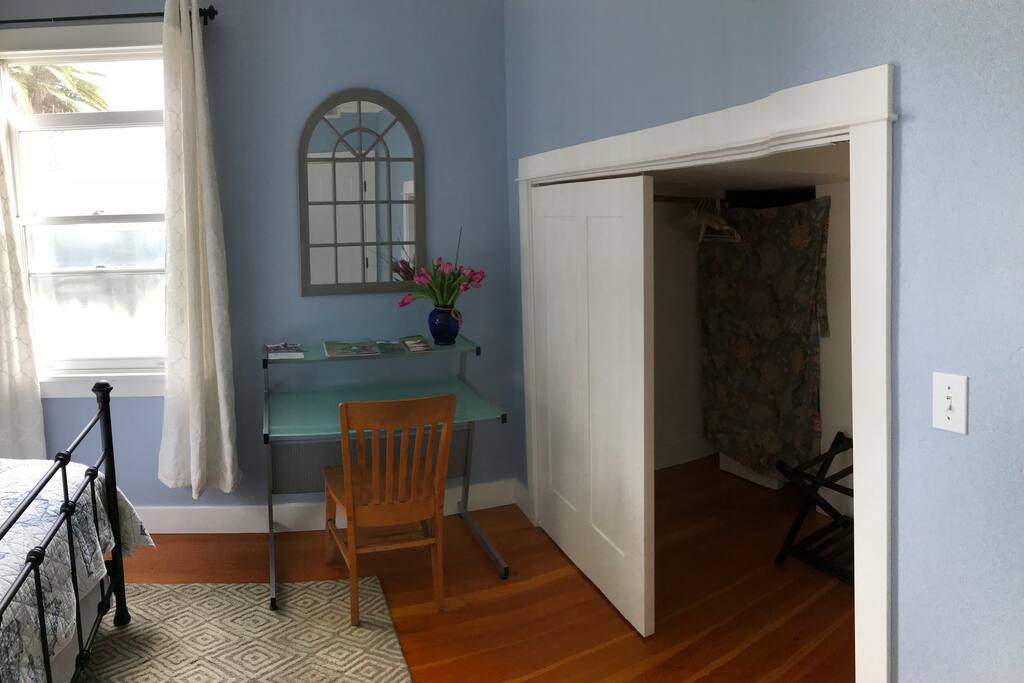 Desk and walk in closet with plenty of space for your luggage