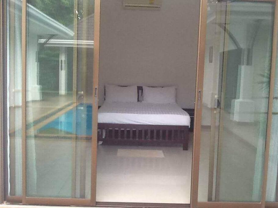 Bedroom in the main villa. Faces the pool and the 1 storey Sala outside.