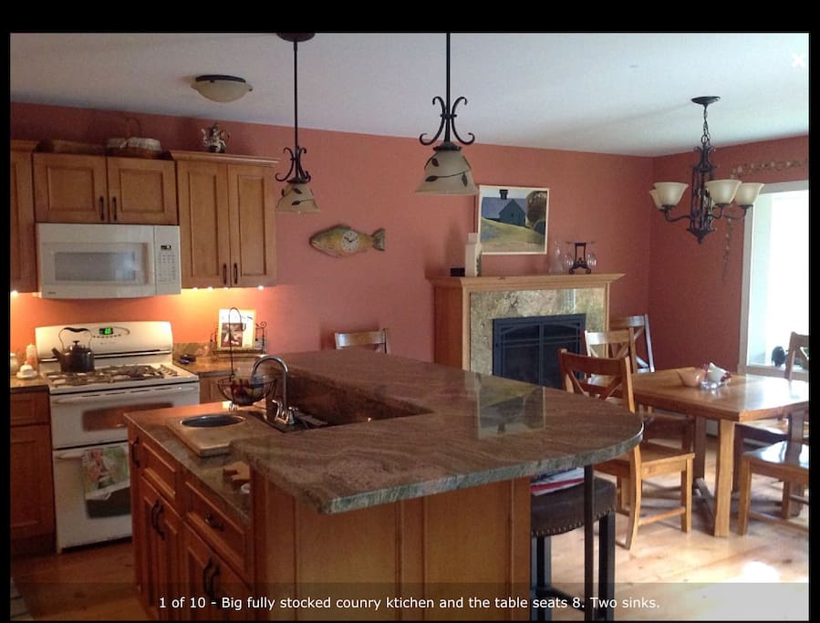 Fully stocked kitchen with round table that seats 8 and counter that seats 3. Gas fireplace for cozy meals.