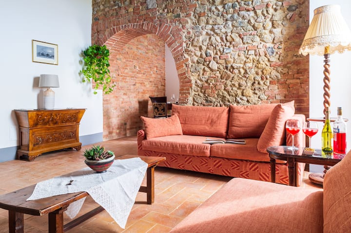  An authentic living space. 
Terracotta floors, antique furniture, brick walls that are kept from original structure and arches.
Enjoy spending time all together in our sitting area. 
One of the sofas can be convertible to a queen size-bed . 