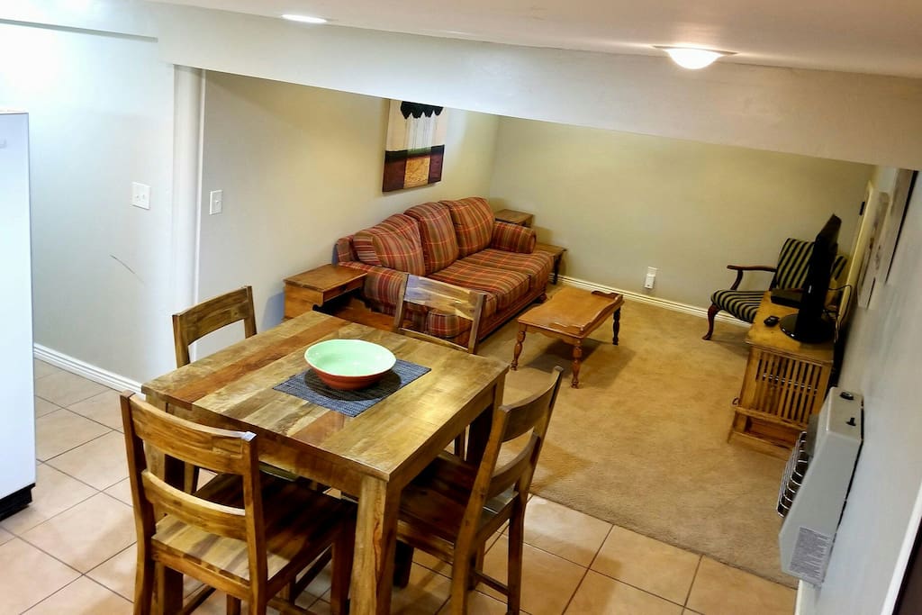 Nice dinning table for four and cozy living room!