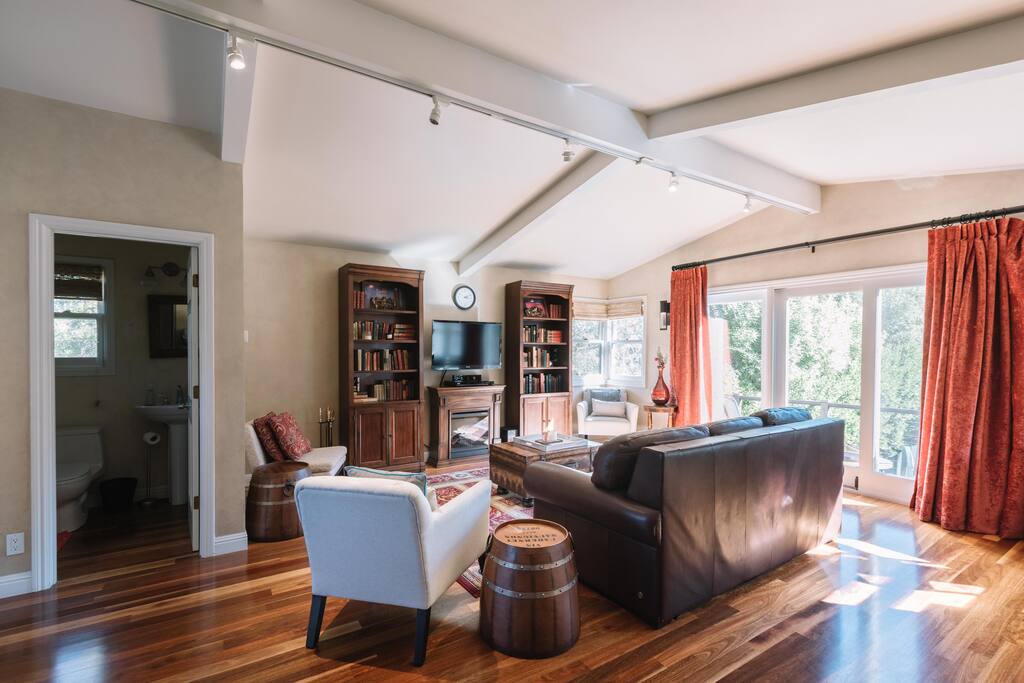 Living room with view of bathroom on left.