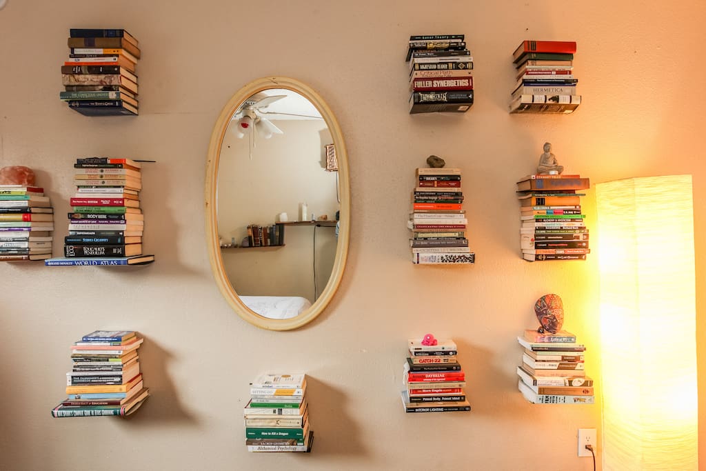 Personal growth library on the wall.