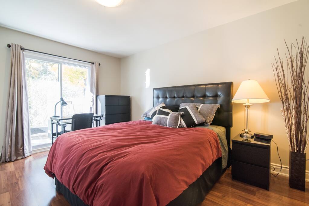 Spacious master bedroom includes digital clock radio, laptop friendly work-desk with chair and worklamp