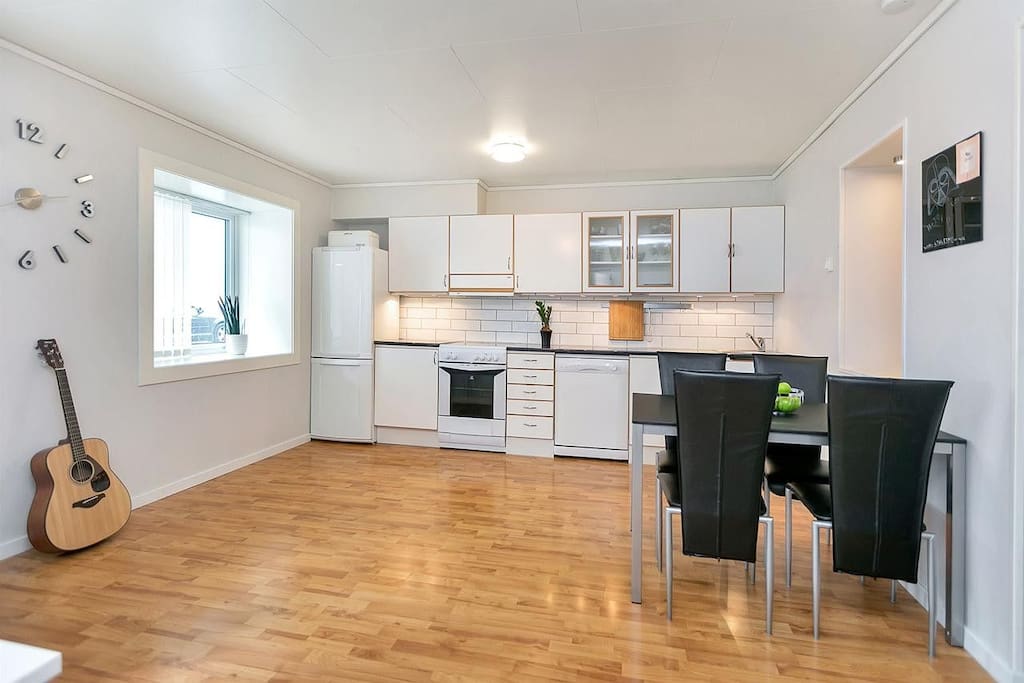 Kitchen and dining table. The dining table is now replaced with a bigger white one.