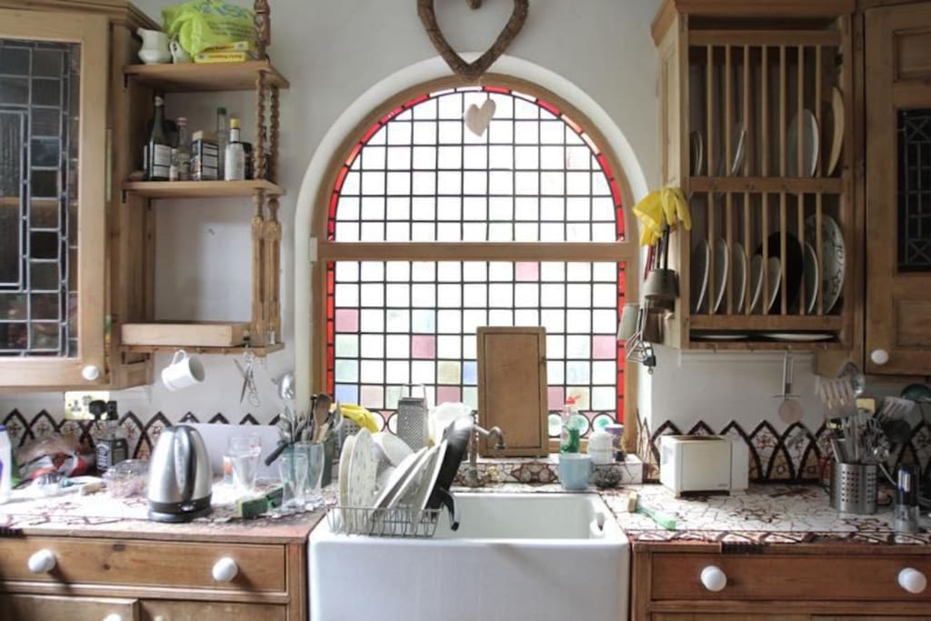 Kitchen - with stunning stained glass and lots of wood.