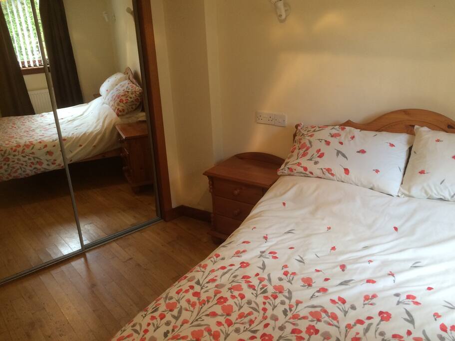 Double bedroom with mirrored wardrobes