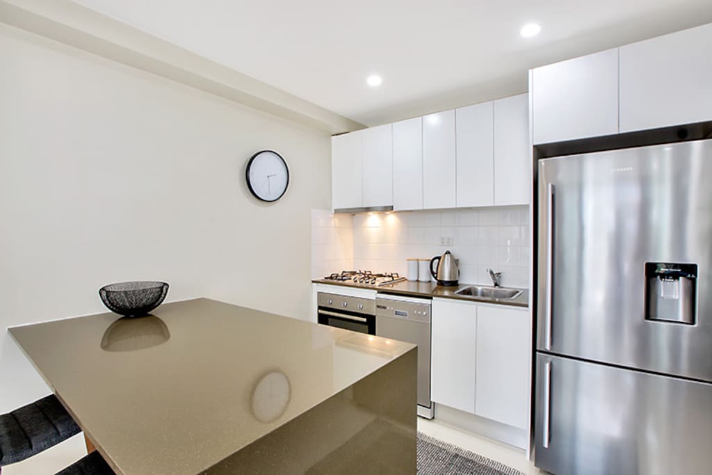 Modern kitchen with gas cooktop and dishwasher