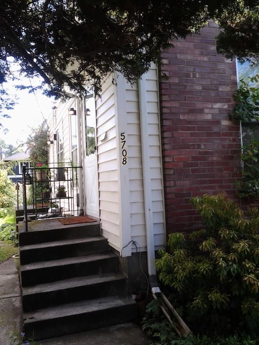 Front porch entry and sitting area behind.