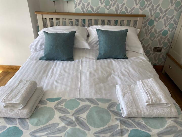 Bedroom 1  - king size bed, Emma mattress and feather bedding 
White crisp bedding 