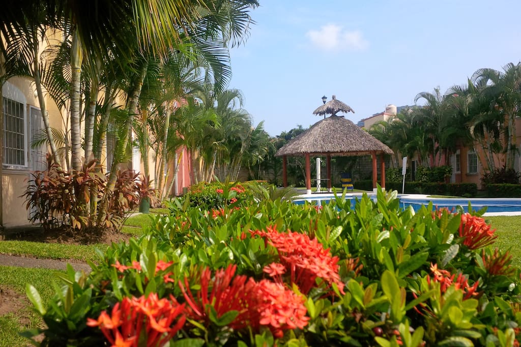 Our condo complex as you walk in Pool and palapa