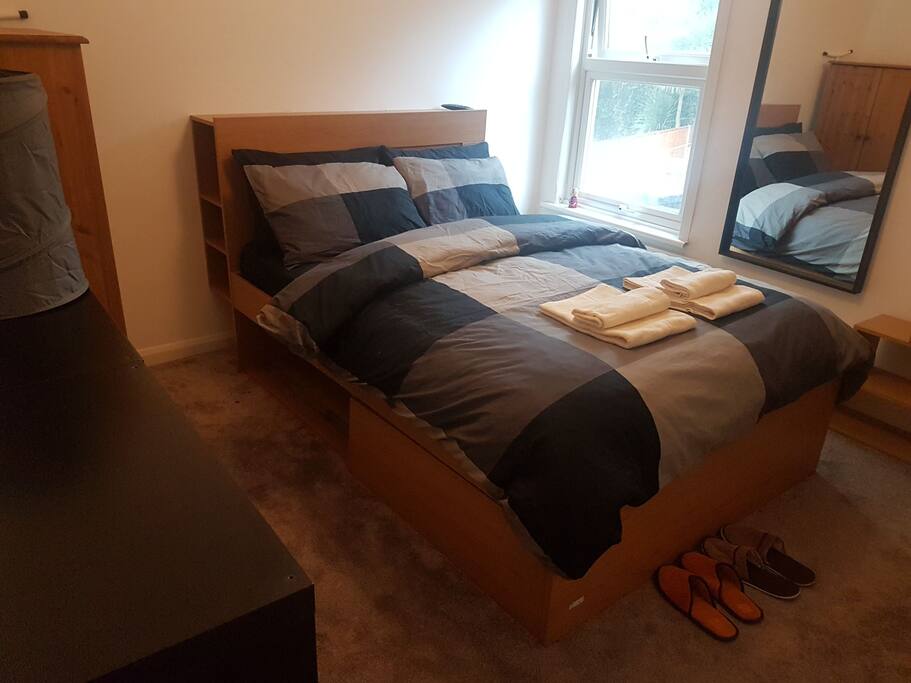 The room - view 3: 2nd bedroom furnished with double storage bed, chest of drawers, wardrobe and bookcase
