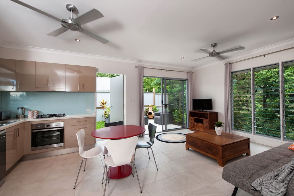 Open plan living area links to outdoor patio.