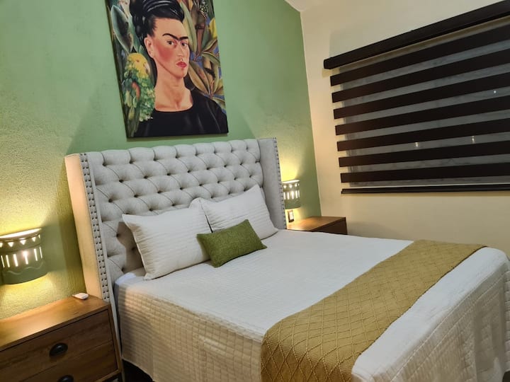 Bedroom with queen size bed.