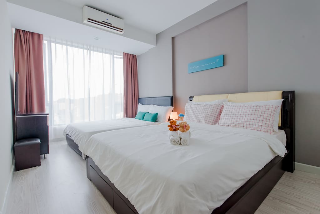 Bedroom 1 with 2 queen size beds. Suitable for 4 guests.