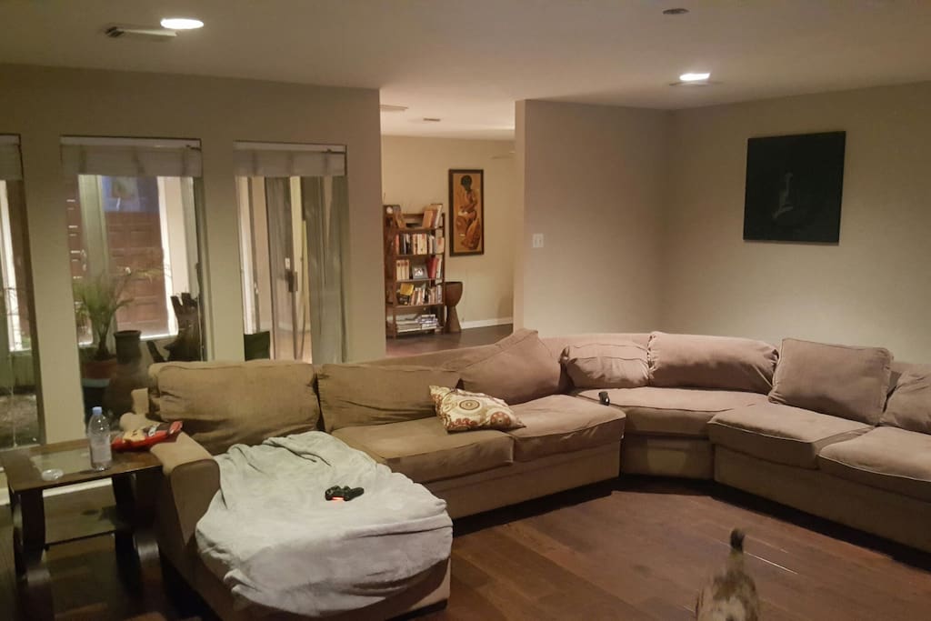 Large 6 person couch that sits in front +60" TV