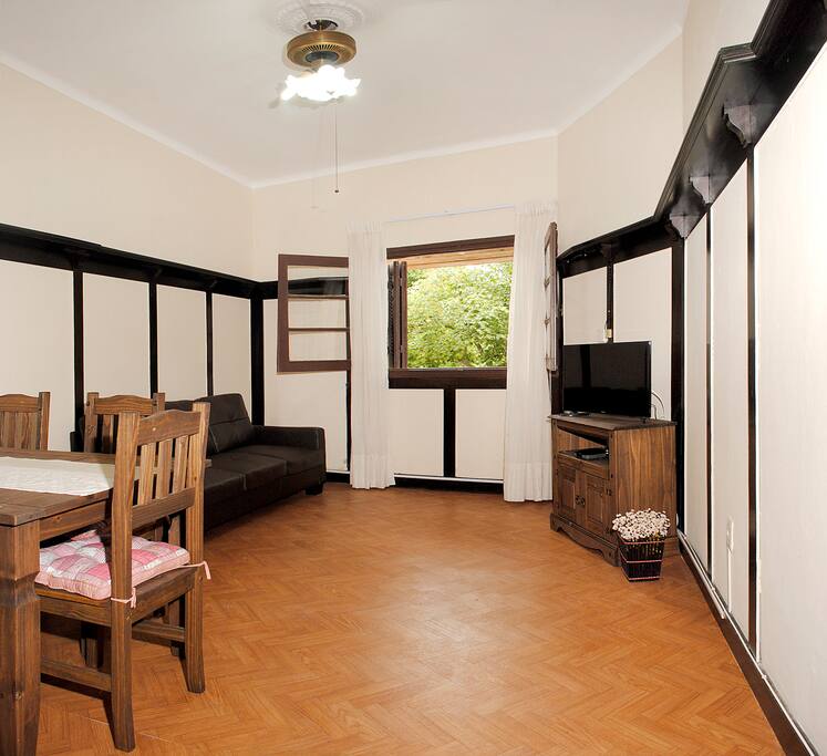 Dining room and living room with a Smart TV and an HDMI outlet. The sofa is a pull out couch, so one person can sleep here as well