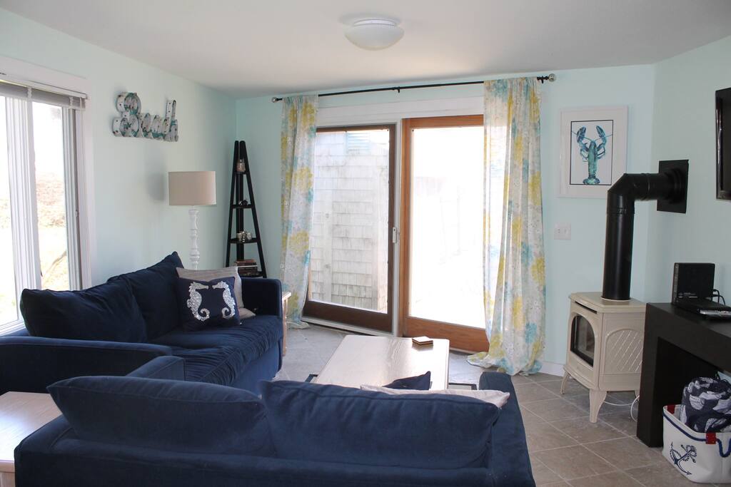 Living room with Queen Sleeper Sofa, Love Seat and Gas Stove - great for those chilly Cape Cod nights!