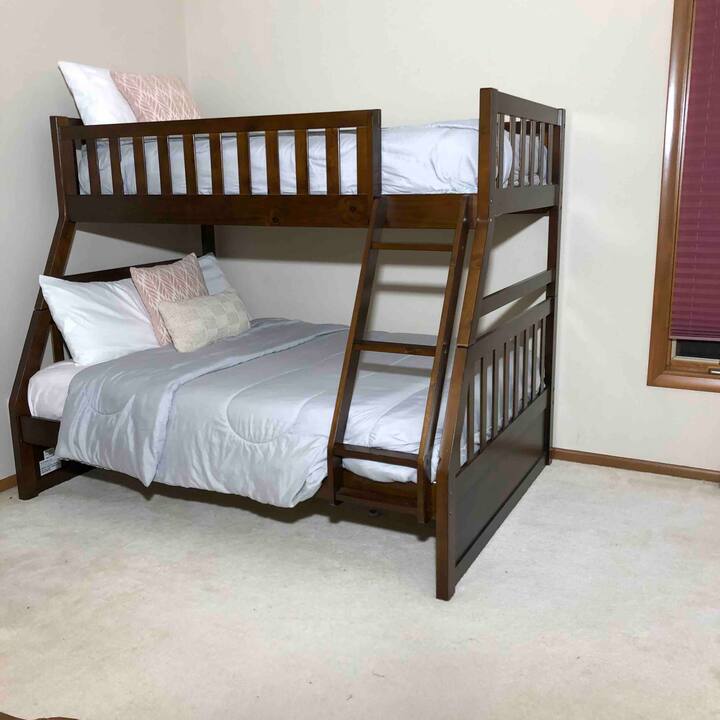 The third bedroom features full bottom bunk bed and twin top bunk bed