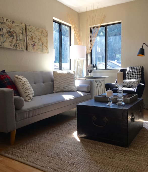 Open Living, Dining and Kitchen. Sofa opens to a full size bed for additional guests.