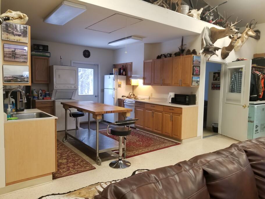 Full Service Kitchen with Dishwasher, Electric Stove & Hood Vent, Microwave and Cookware as well as Laundry