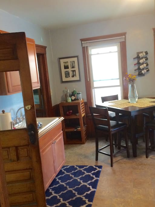 Alternate kitchen view with extra door leading to bathroom for added security and privacy
