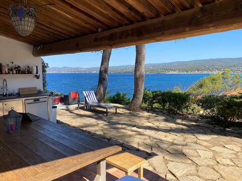 Beachfront villa, feet in the water.
