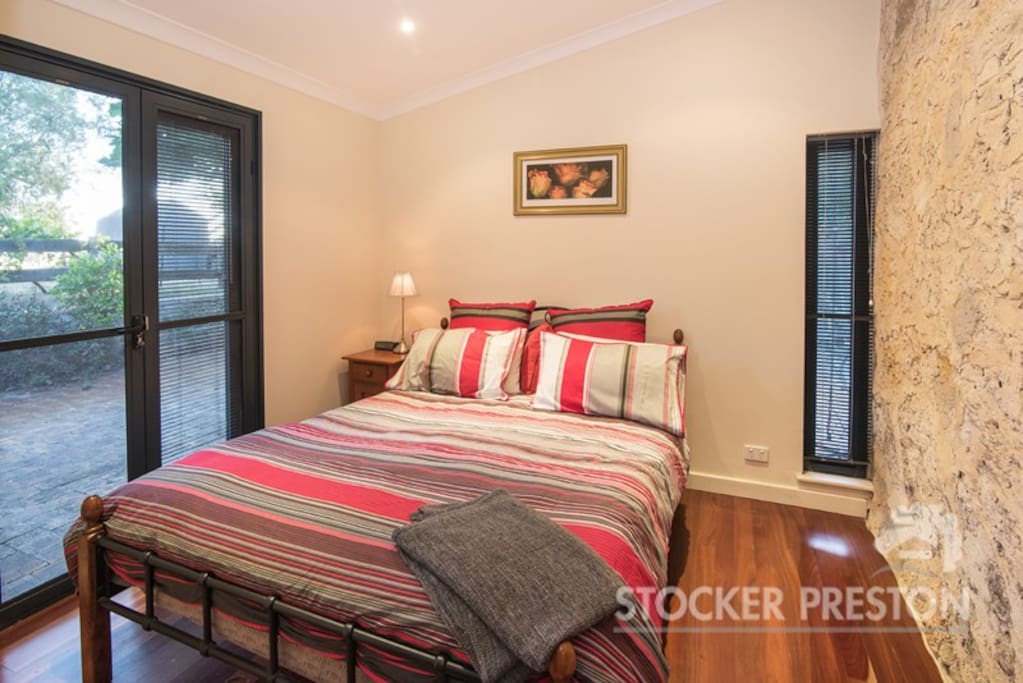One of two queen size bedrooms