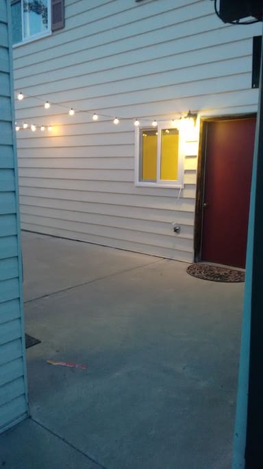 The Cozy Farmhouse's private suite has a separate entrance near the detached garage. It's got its own key and lit patio.