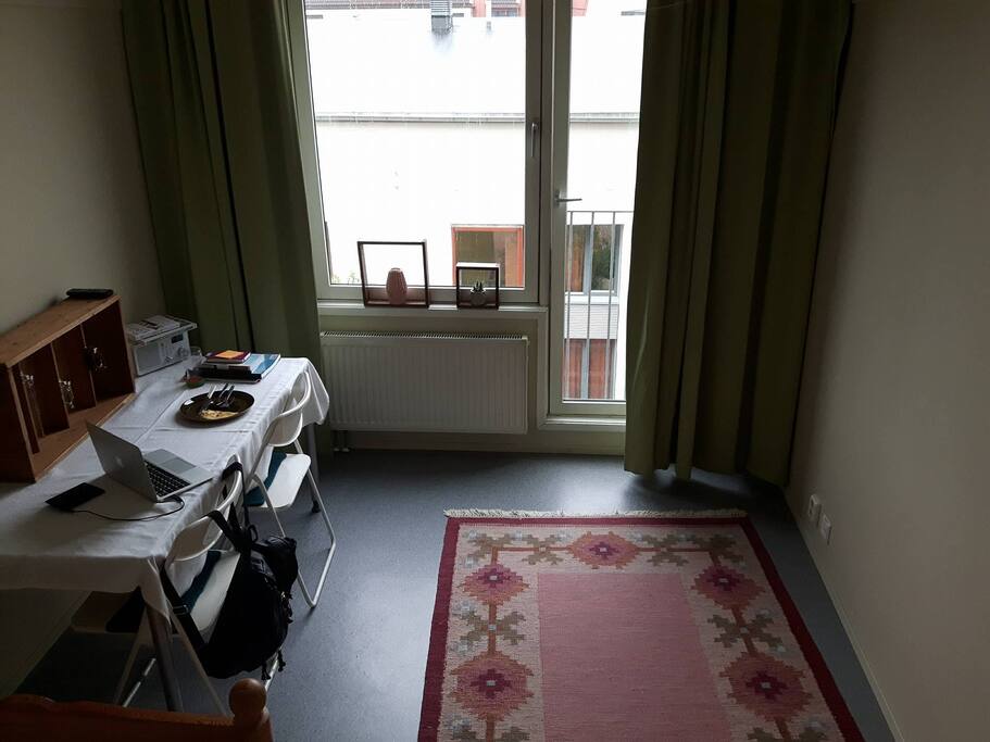 The main room. View over a shorter apartment on the other side, but a really nice view over the opposite apartments rooftop.