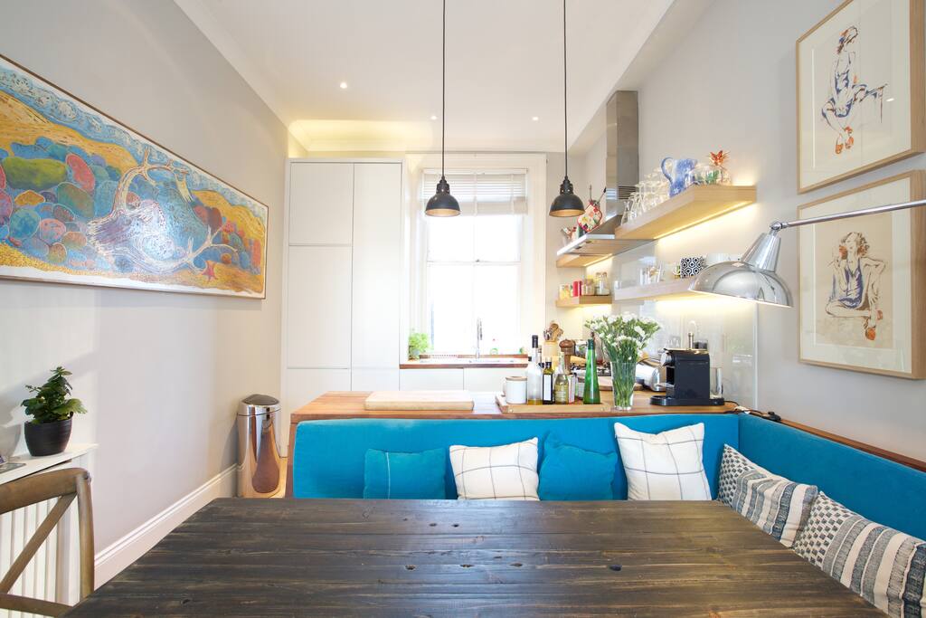 The beautiful kitchen and dining area fitted with all modern appliances including a dish washer, microwave and coffee machine.