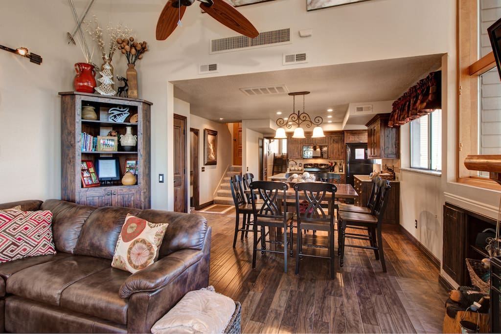 An open layout leads from kitchen, to dining, to comfy living area