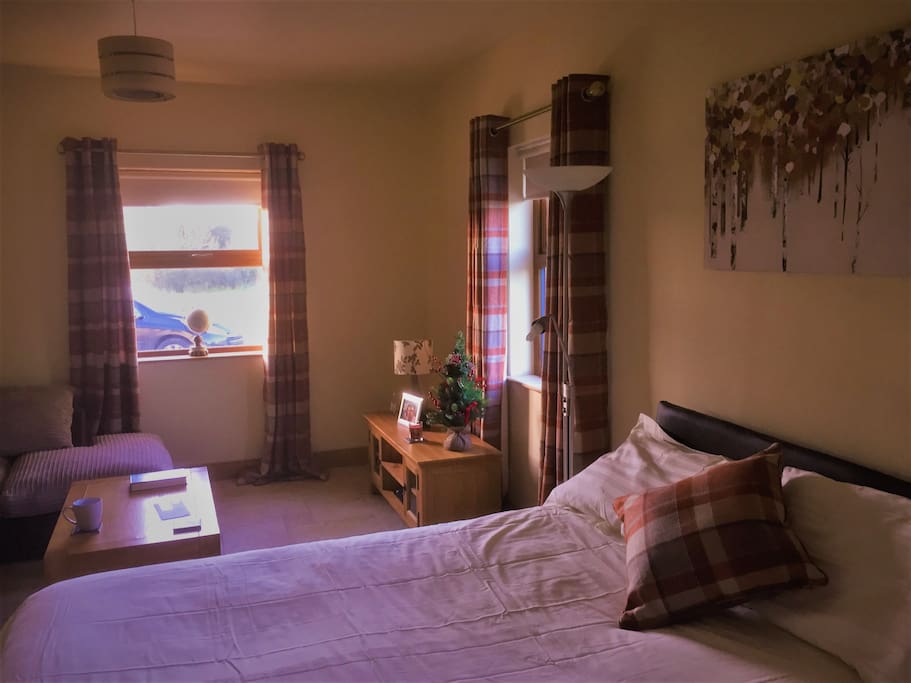 Large bedroom with TV and ensuite