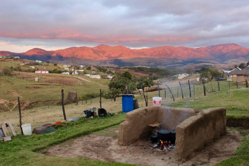 Another homestay's outdoor wood cooking area at sunset