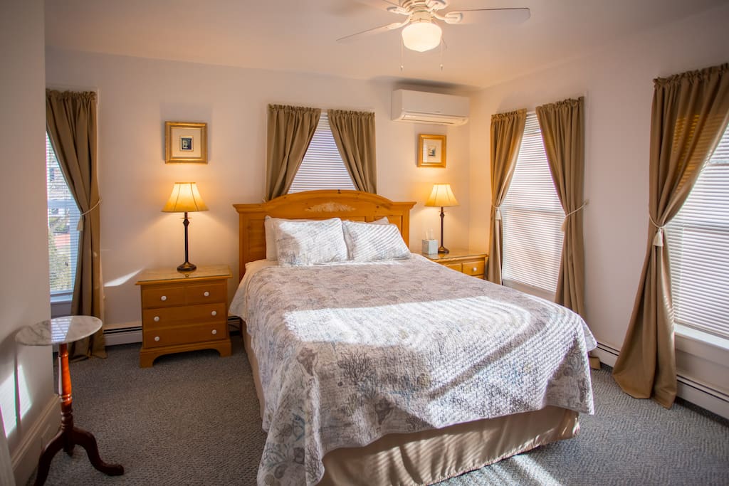 bedroom with room darkening shades and mini split air conditioning. It's very quiet