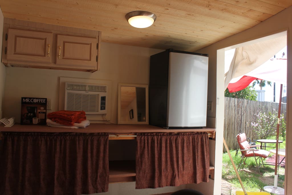 window AC, mini fridge, coffee maker , shelves