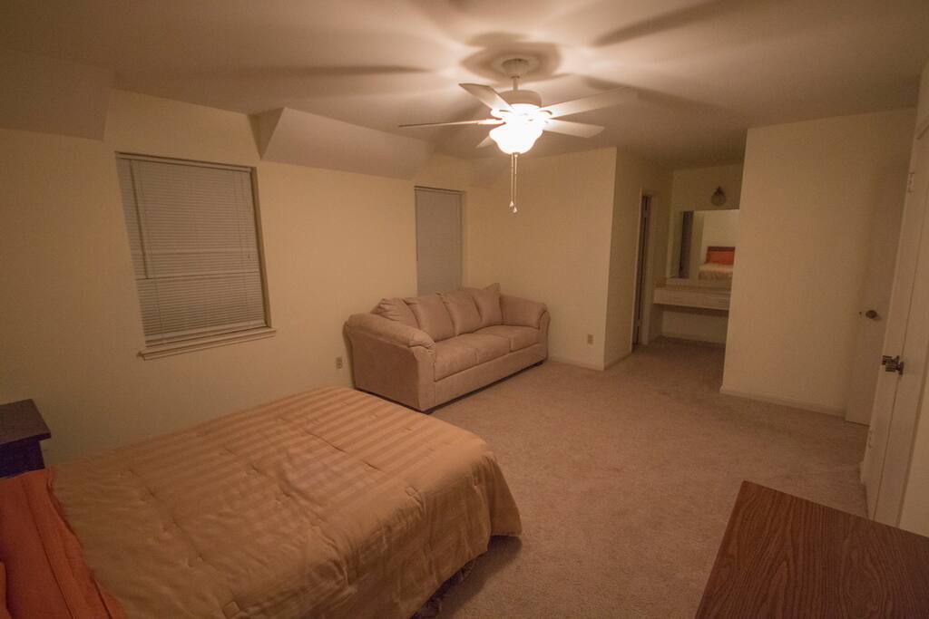 There is a built in desk / dressing table. Private bathroom entrance to the left