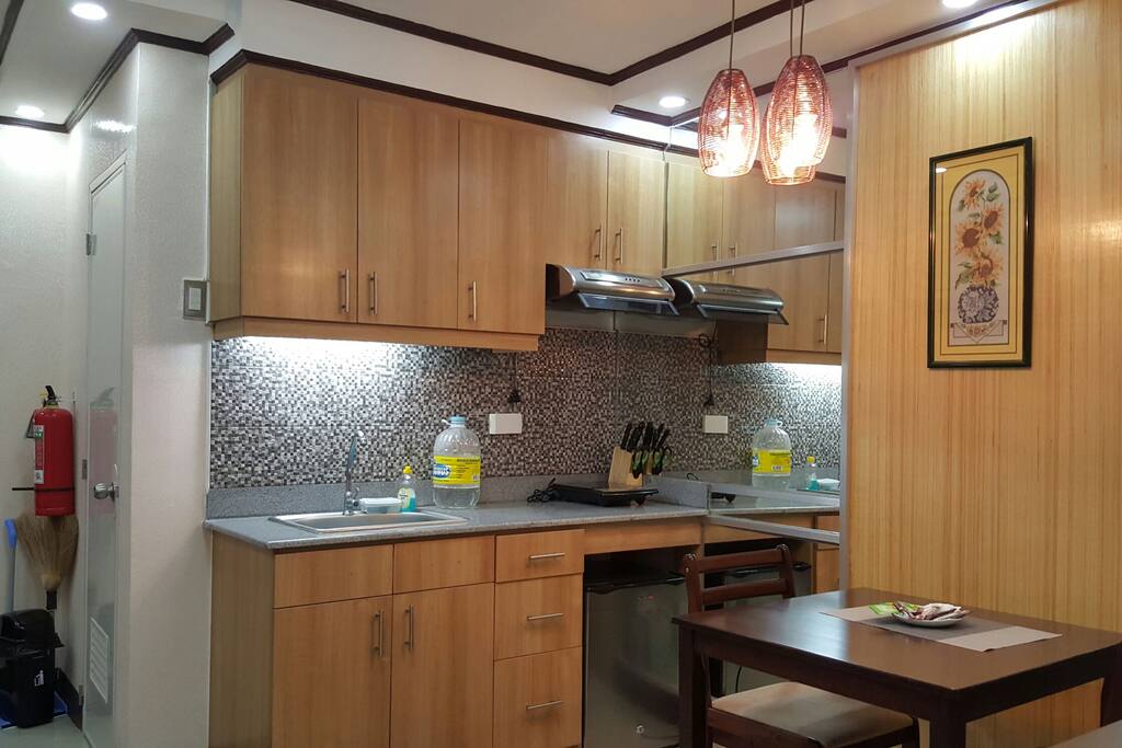 Kitchen with mini refrigerator and built in cabinets