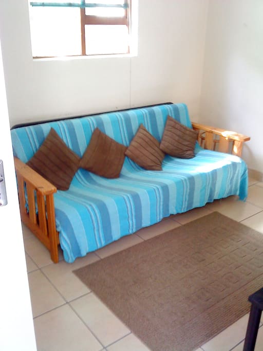 The couch in the compact lounge folds out into a double bed