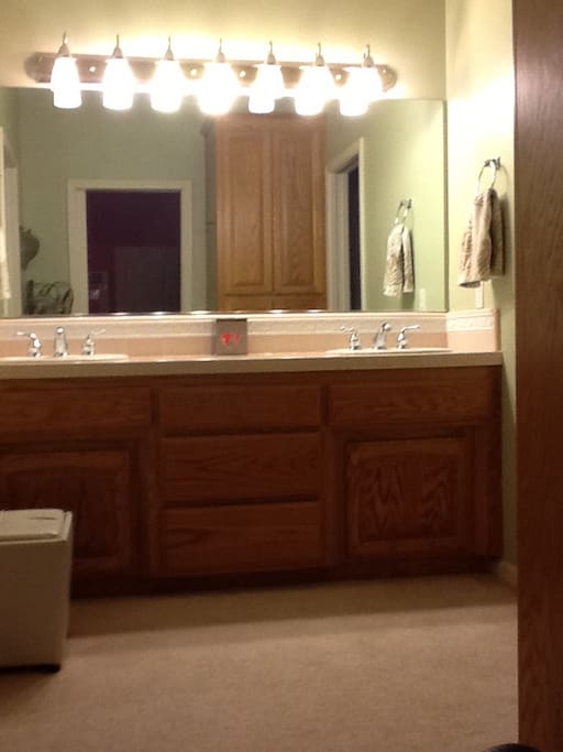 Shared bathroom: two sinks / separate shower/toilet area