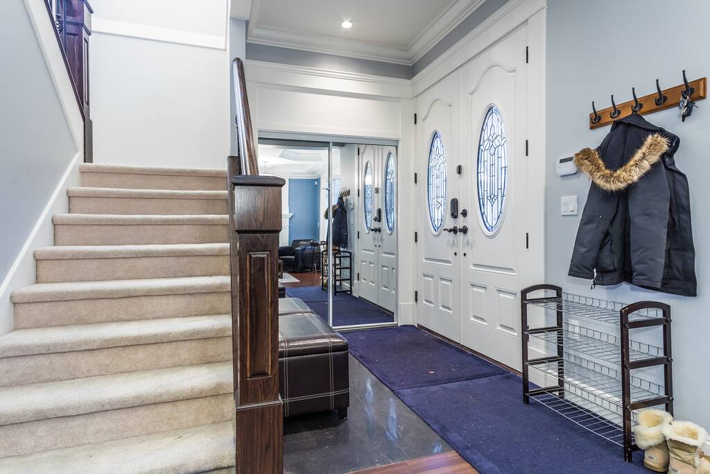 Foyer and stairs to upper level.