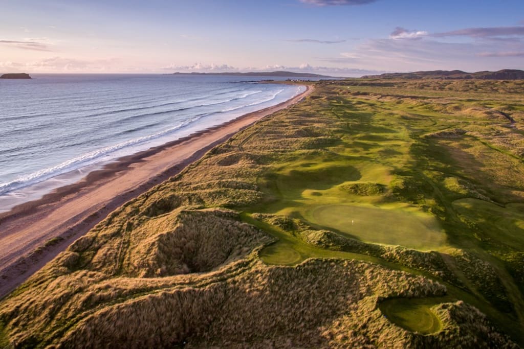 Ballyliffin’s Glashedy Links
Dubai Duty Free Irish Open Hosted by the Rory Foundation
5 – 8 July 2018 is less hthan 60 min drive from Monreagh
The 2018 season will visit Ballyliffin’s Glashedy Links for the first time in its long history this summer and the County Donegal crowds are expected to turn out in force as Spain’s Jon Rahm defends his title.