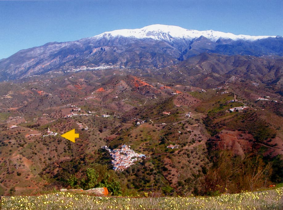 Mountain La Maroma covered in snow and Hacienda Sol marked with arrow