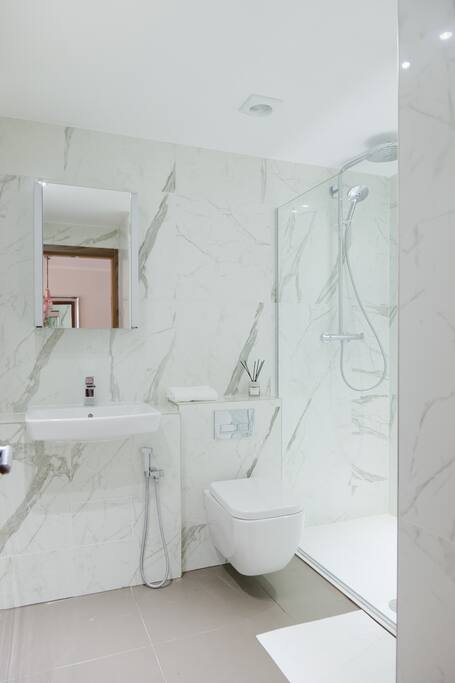 Bright, high quality bathroom with spacious walk in shower
