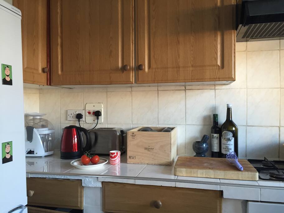 Kitchen with kettle, toaster, juicer and big fridge-freezer