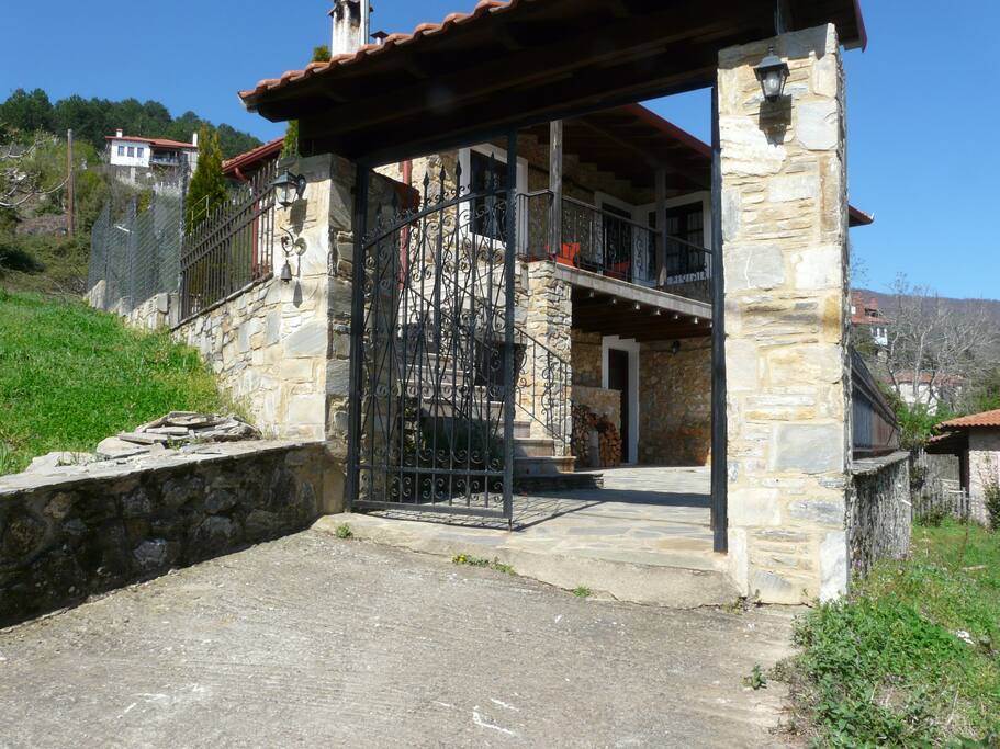 Entrance to the yard and part of the parking space.
